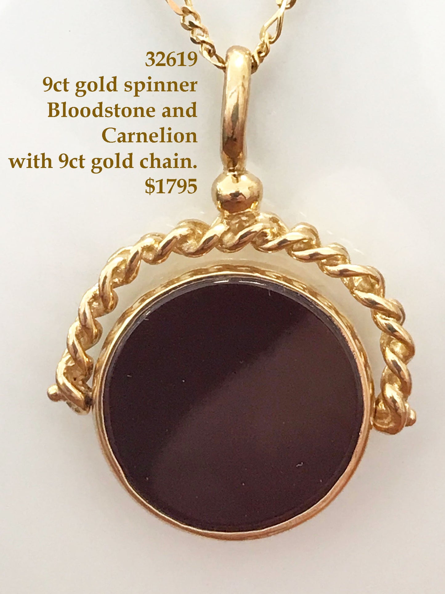 Spinner pendant and gold chain.