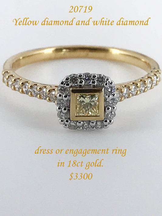 Yellow diamond and white diamond 18ct yellow gold ring.